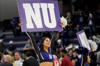 Jan 23, 2023; Evanston, Illinois, USA; A Northwestern Wildcats cheerleader during the first half against the Wisconsin Badgers at Welsh-Ryan Arena. Mandatory Credit: David Banks-Imagn Images
