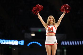 Mar 16, 2023; Birmingham, AL, USA; Maryland Terrapins cheerleader performs against the West Virginia Mountaineers during the first half in the first round of the 2023 NCAA Tournament at Legacy Arena. Mandatory Credit: Vasha Hunt-Imagn Images