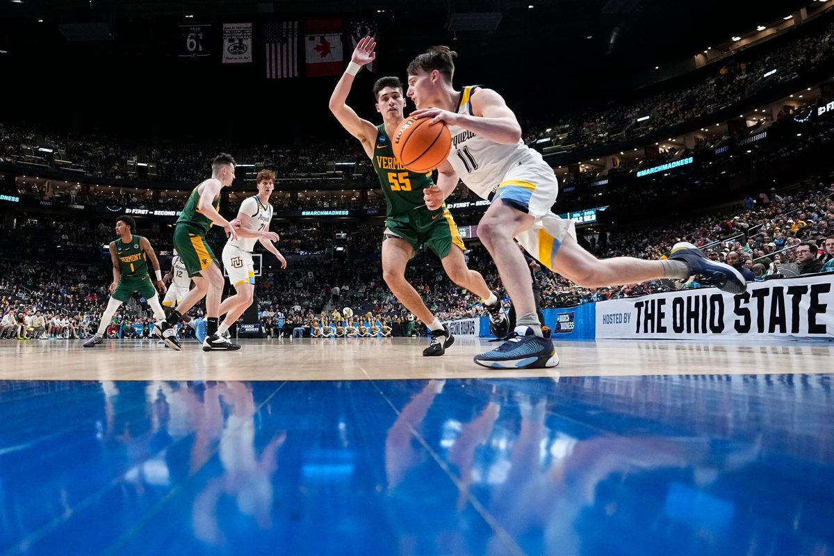 Mar 17, 2023; Columbus, Ohio, USA; Marquette Golden Eagles guard Tyler Kolek (11) drives past Vermont Catamounts guard Robin Duncan (55) during the first round of the NCAA men s basketball tournament at Nationwide Arena. Marquette won 78-61. Mandatory Credit: Adam Cairns-The Columbus Dispatch
Basketball Ncaa Men S Basketball Tournament