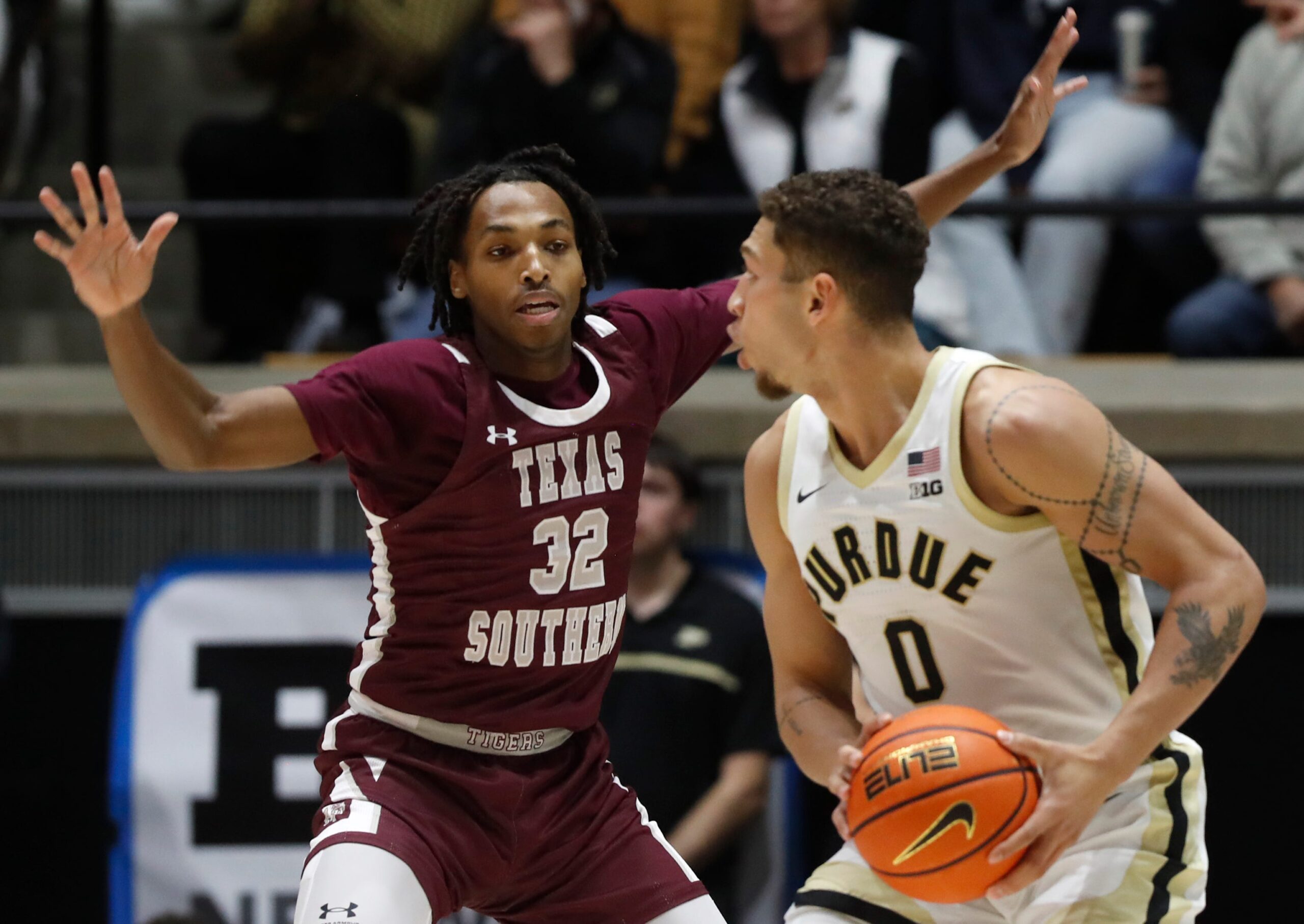 Texas Southern Tigers Kelhin Farooq (32) defends Purdue Boilermakers forward Mason Gillis (0) during the NCAA men   s basketball game, Tuesday, Nov. 28, 2023, at Mackey Arena in West Lafayette, Ind.