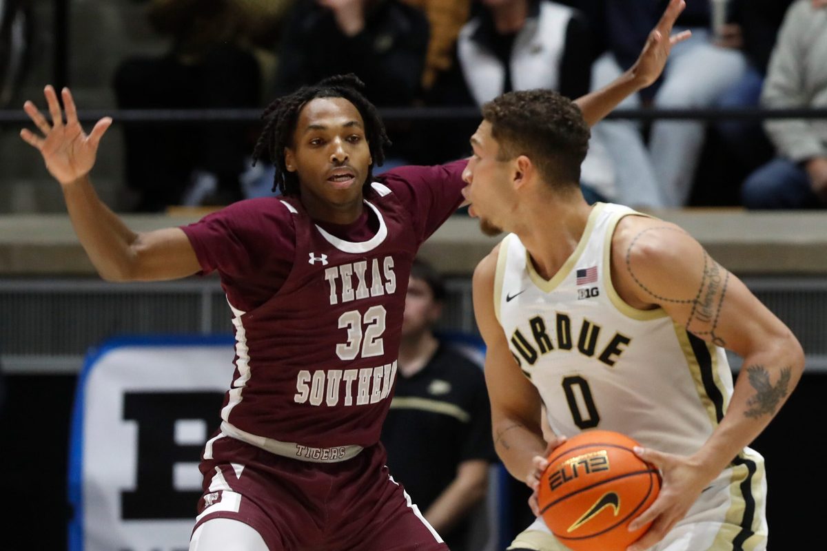 Texas Southern Tigers Kelhin Farooq (32) defends Purdue Boilermakers forward Mason Gillis (0) during the NCAA men s basketball game, Tuesday, Nov. 28, 2023, at Mackey Arena in West Lafayette, Ind.