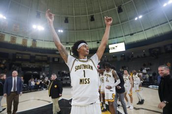 Jan 6, 2024; Hattiesburg, Mississippi, USA; Southern Miss Golden Eagles guard Austin Crowley (1) celebrates their win over the James Madison Dukes at Reed Green Coliseum. Mandatory Credit: Chuck Cook-Imagn Images
