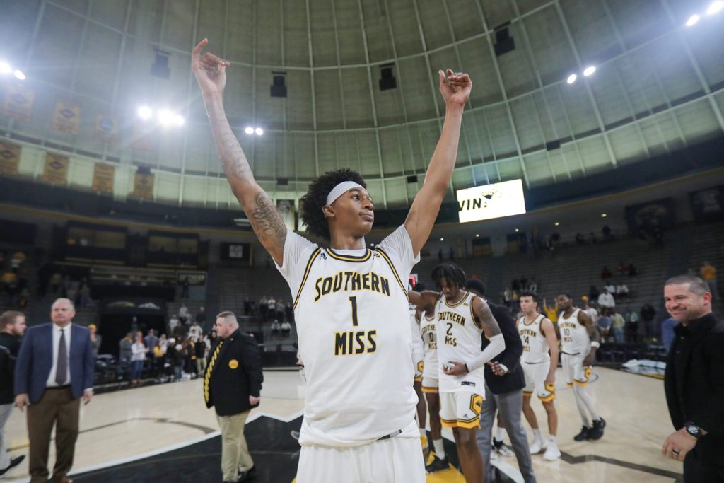 Jan 6, 2024; Hattiesburg, Mississippi, USA; Southern Miss Golden Eagles guard Austin Crowley (1) celebrates their win over the James Madison Dukes at Reed Green Coliseum. Mandatory Credit: Chuck Cook-Imagn Images