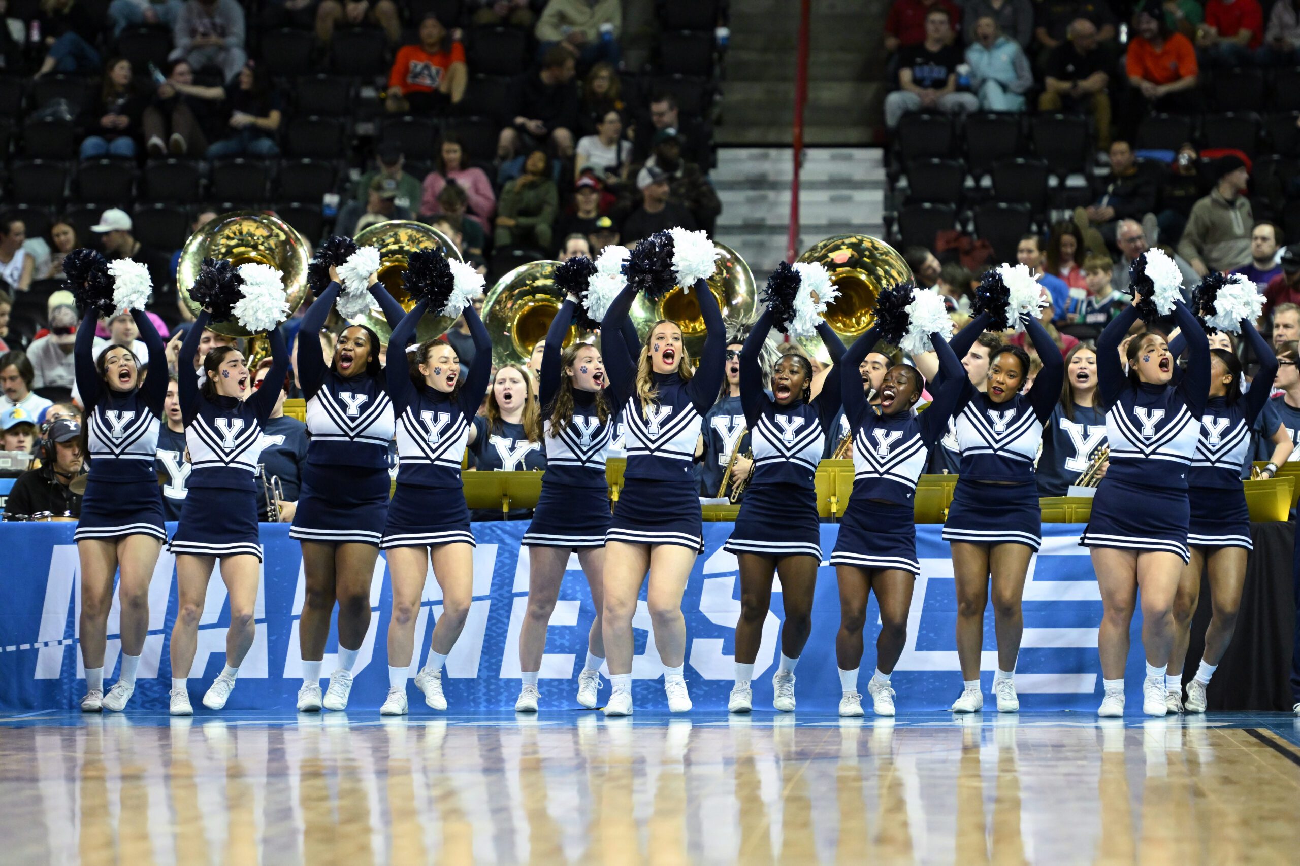 Mar 22, 2024; Spokane, WA, USA; Yale Bulldogs cheerleaders perform during the first half of a game against the Auburn Tigers in the first round of the 2024 NCAA Tournament at Spokane Veterans Memorial Arena. Mandatory Credit: James Snook-Imagn Images