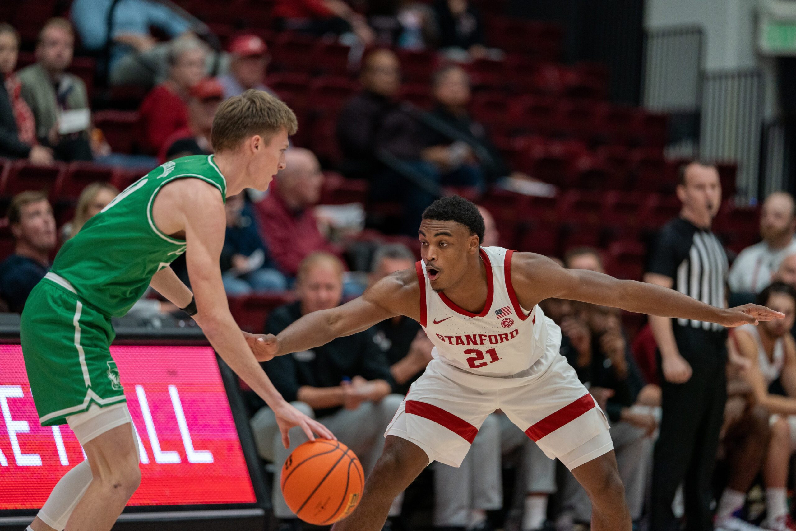 Dec 3, 2024; Stanford, California, USA; Utah Valley Wolverines guard Trevan Leonhardt (10) is guarded by Stanford Cardinal guard Jaylen Blakes (21) during the first quarter at Maples Pavilion. Mandatory Credit: Neville E. Guard-Imagn Images
