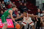 Dec 3, 2024; Stanford, California, USA; Utah Valley Wolverines guard Trevan Leonhardt (10) is guarded by Stanford Cardinal guard Jaylen Blakes (21) during the first quarter at Maples Pavilion. Mandatory Credit: Neville E. Guard-Imagn Images