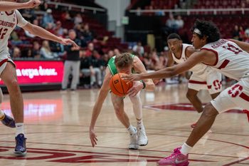 Dec 3, 2024; Stanford, California, USA; Utah Valley Wolverines guard Trevan Leonhardt (10) and Stanford Cardinal guard Ryan Agarwal (11) battle for the loose basketball during the second half at Maples Pavilion. Mandatory Credit: Neville E. Guard-Imagn Images