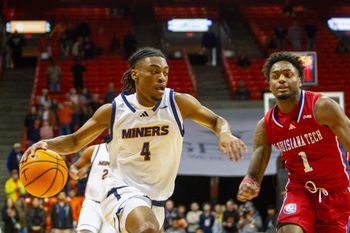 UTEP's Corey Camper Jr. (4) attempts to dribble past Louisiana Tech's Amaree Abram (1) at the Don Haskins Center in El Paso, Texas, on Jan. 2, 2025.