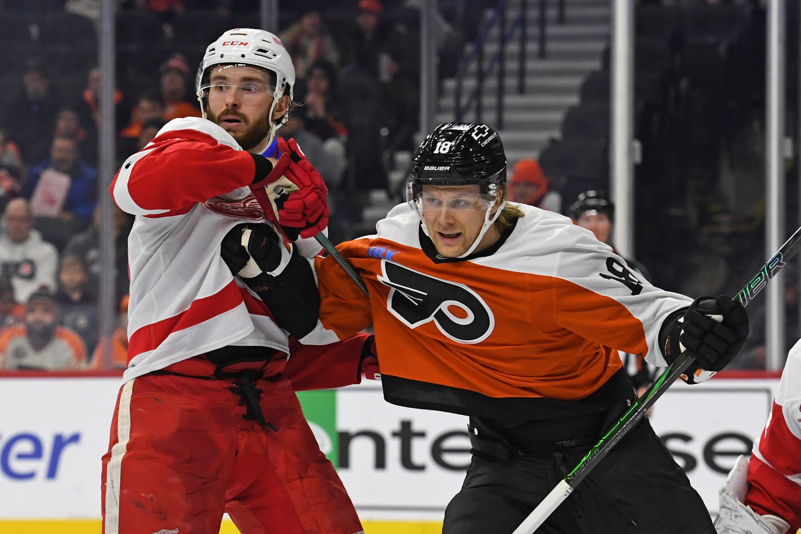 Jan 21, 2025; Philadelphia, Pennsylvania, USA; Detroit Red Wings center Michael Rasmussen (27) and Philadelphia Flyers center Rodrigo Abols (18) battle for position during the third period at Wells Fargo Center. Mandatory Credit: Eric Hartline-Imagn Images