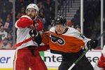 Jan 21, 2025; Philadelphia, Pennsylvania, USA; Detroit Red Wings center Michael Rasmussen (27) and Philadelphia Flyers center Rodrigo Abols (18) battle for position during the third period at Wells Fargo Center. Mandatory Credit: Eric Hartline-Imagn Images
