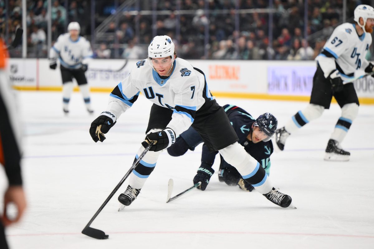 Mar 14, 2025; Seattle, Washington, USA; Utah Hockey Club defenseman Michael Kesselring (7) plays the puck during the second period against the Seattle Kraken at Climate Pledge Arena. Mandatory Credit: Steven Bisig-Imagn Images