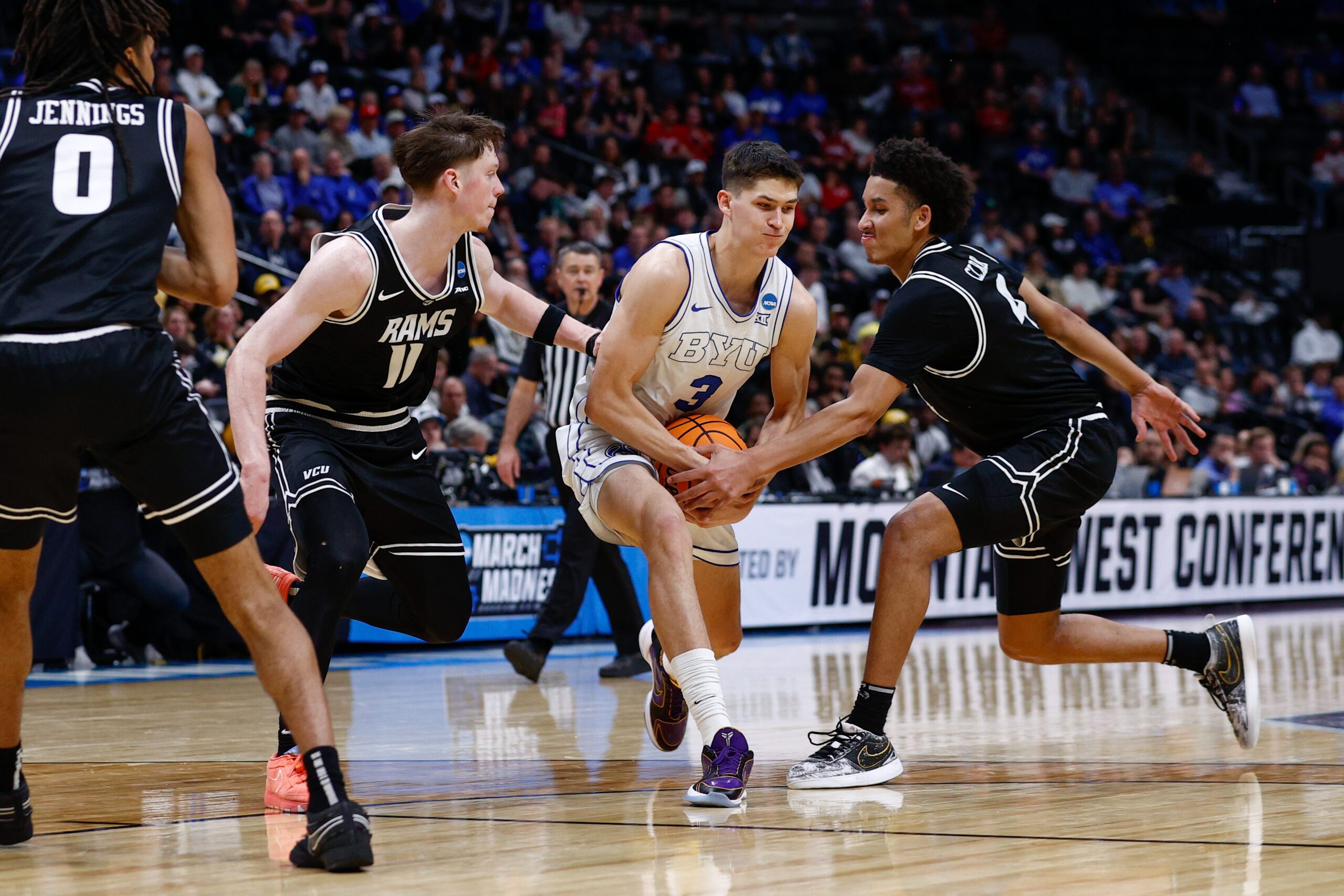 Mar 20, 2025; Denver, CO, USA; VCU Rams guard Max Shulga (11) and forward Jack Clark (4) defend against Brigham Young Cougars guard Egor Demin (3) during the second half in the first round of the NCAA Tournament at Ball Arena. Mandatory Credit: Isaiah J. Downing-Imagn Images