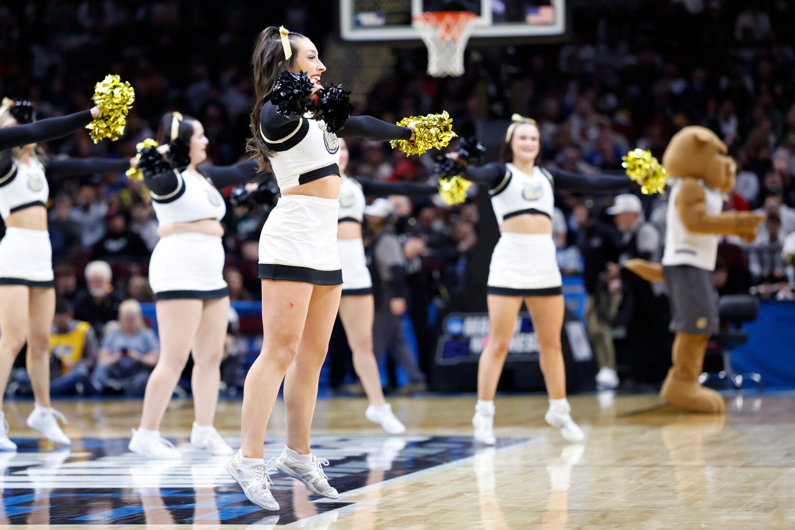 Mar 21, 2025; Cleveland, OH, USA; Bryant University Bulldogs cheerleaders perform in the first half against the Michigan State Spartans during the NCAA Tournament First Round at Rocket Mortgage Fieldhouse. Mandatory Credit: Rick Osentoski-Imagn Images