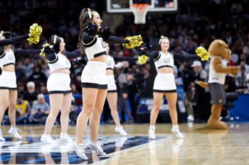 Mar 21, 2025; Cleveland, OH, USA; Bryant University Bulldogs cheerleaders perform in the first half against the Michigan State Spartans during the NCAA Tournament First Round at Rocket Mortgage Fieldhouse. Mandatory Credit: Rick Osentoski-Imagn Images