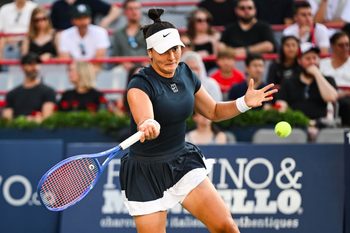 Jul 27, 2025; Montreal, QC, Canada; Bianca Andreescu (CAN) returns the ball to Barbora Krejcikova (CZE) in first round play at IGA Stadium. Mandatory Credit: David Kirouac-Imagn Images