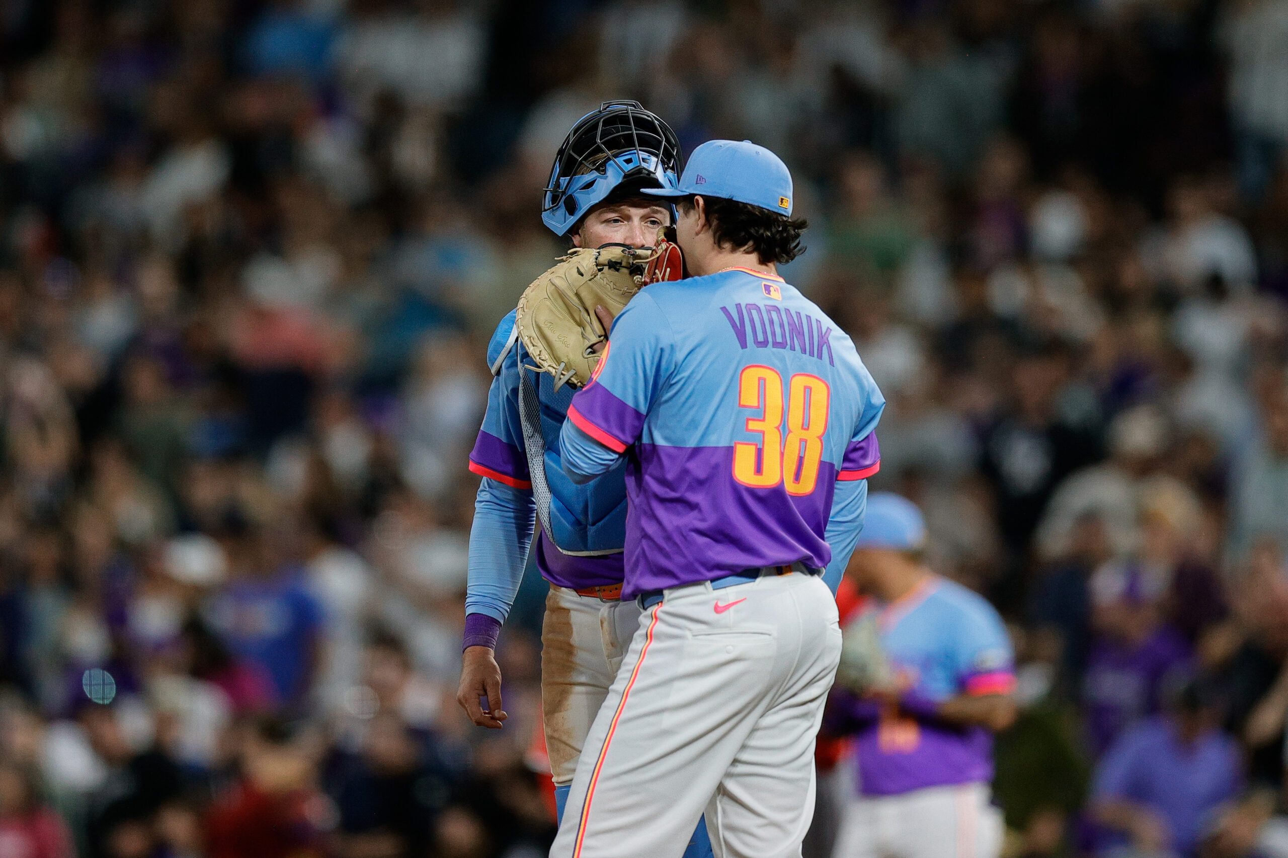Sep 19, 2025; Denver, Colorado, USA; Colorado Rockies catcher Hunter Goodman (15) talks with relief pitcher Victor Vodnik (38) in the ninth inning against the Los Angeles Angels at Coors Field. Mandatory Credit: Isaiah J. Downing-Imagn Images