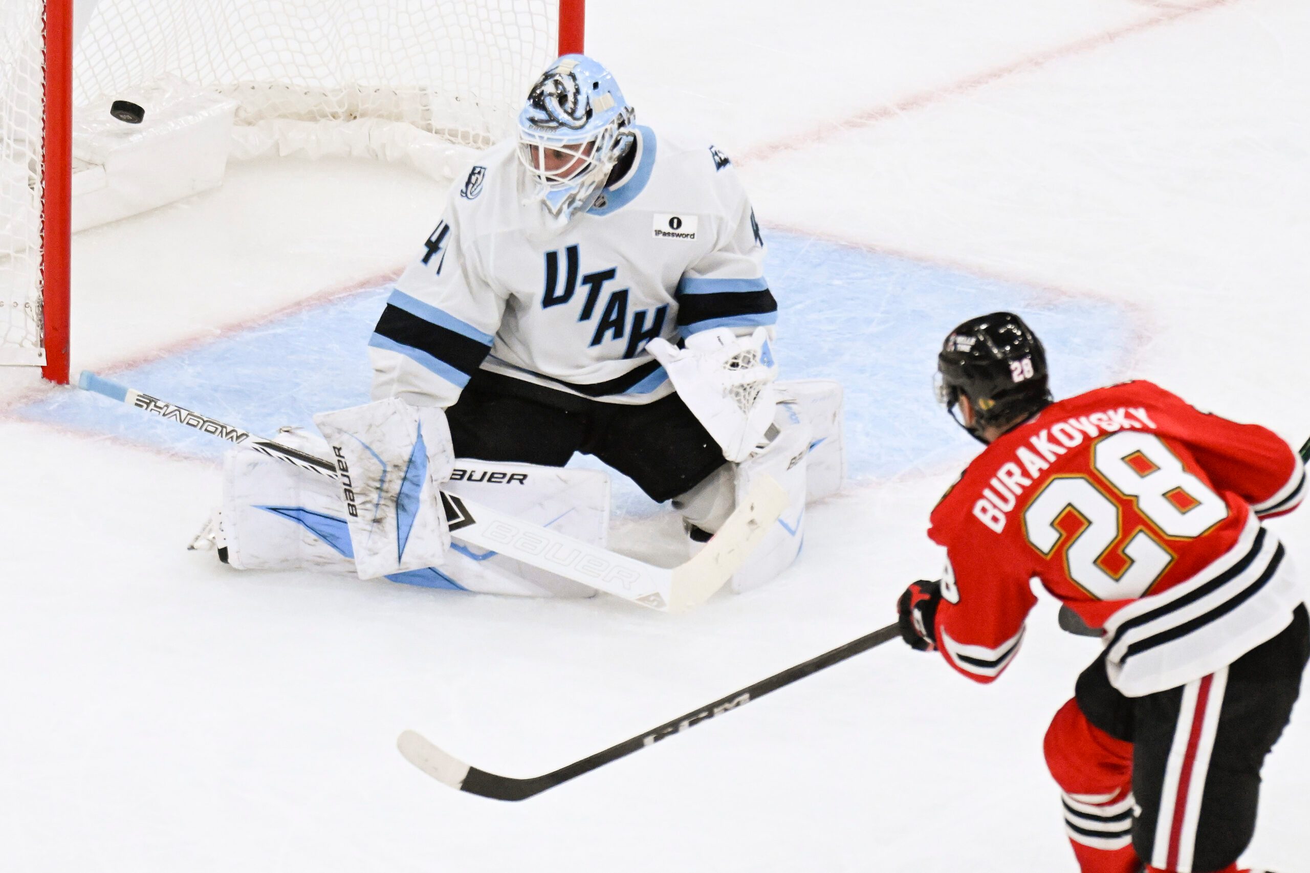 Oct 13, 2025; Chicago, Illinois, USA;  Chicago Blackhawks left wing Andre Burakovsky (28) scores past Utah Mammoth goaltender Vitek Vanecek (41) during the third period at United Center. Mandatory Credit: Matt Marton-Imagn Images