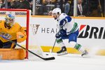 Oct 23, 2025; Nashville, Tennessee, USA;  Vancouver Canucks right wing Conor Garland (8) skates behind the net against the Nashville Predators during the second period at Bridgestone Arena. Mandatory Credit: Steve Roberts-Imagn Images