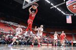 Oct 25, 2025; Pullman, WA, USA; New Mexico Lobos forward Tomislav Buljan (10) dunks the ball against Washington State Cougars forward Simon Hildebrandt (3) in the first half at Friel Court at Beasley Coliseum. Mandatory Credit: James Snook-Imagn Images