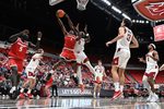 Oct 25, 2025; Pullman, WA, USA; New Mexico Lobos guard Deyton Albury (1) shoots the ball against Washington State Cougars forward Emmanuel Ugbo (0) in the second half at Friel Court at Beasley Coliseum. Washington State Cougars won 74-66. Mandatory Credit: James Snook-Imagn Images