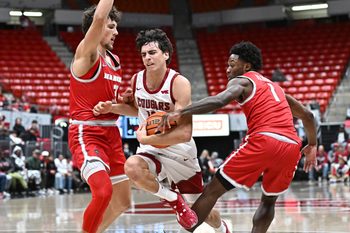Oct 25, 2025; Pullman, WA, USA; Washington State Cougars guard Adria Rodriguez (13) is fouled on the drive by New Mexico Lobos guard Deyton Albury (1) in the second half at Friel Court at Beasley Coliseum. Washington State Cougars won 74-66. Mandatory Credit: James Snook-Imagn Images