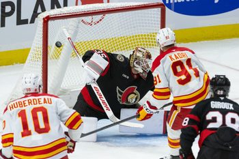 Oct 30, 2025; Ottawa, Ontario, CAN; Calgary Flames center Nazem Kadri (91) scores against Ottawa Senators goalie Linus Ullmark (35) in the third period at the Canadian Tire Centre. Mandatory Credit: Marc DesRosiers-IMAGN Images