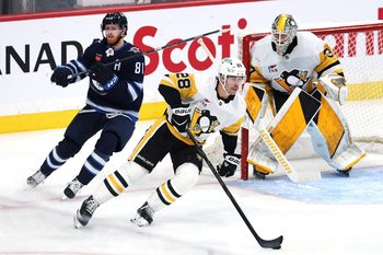 Nov 1, 2025; Winnipeg, Manitoba, CAN; Pittsburgh Penguins defenseman Parker Wotherspoon (28) is chased down by Winnipeg Jets left wing Kyle Connor (81) in front of Pittsburgh Penguins goaltender Arturs Silovs (37) in the third period at Canada Life Centre. Mandatory Credit: James Carey Lauder-Imagn Images