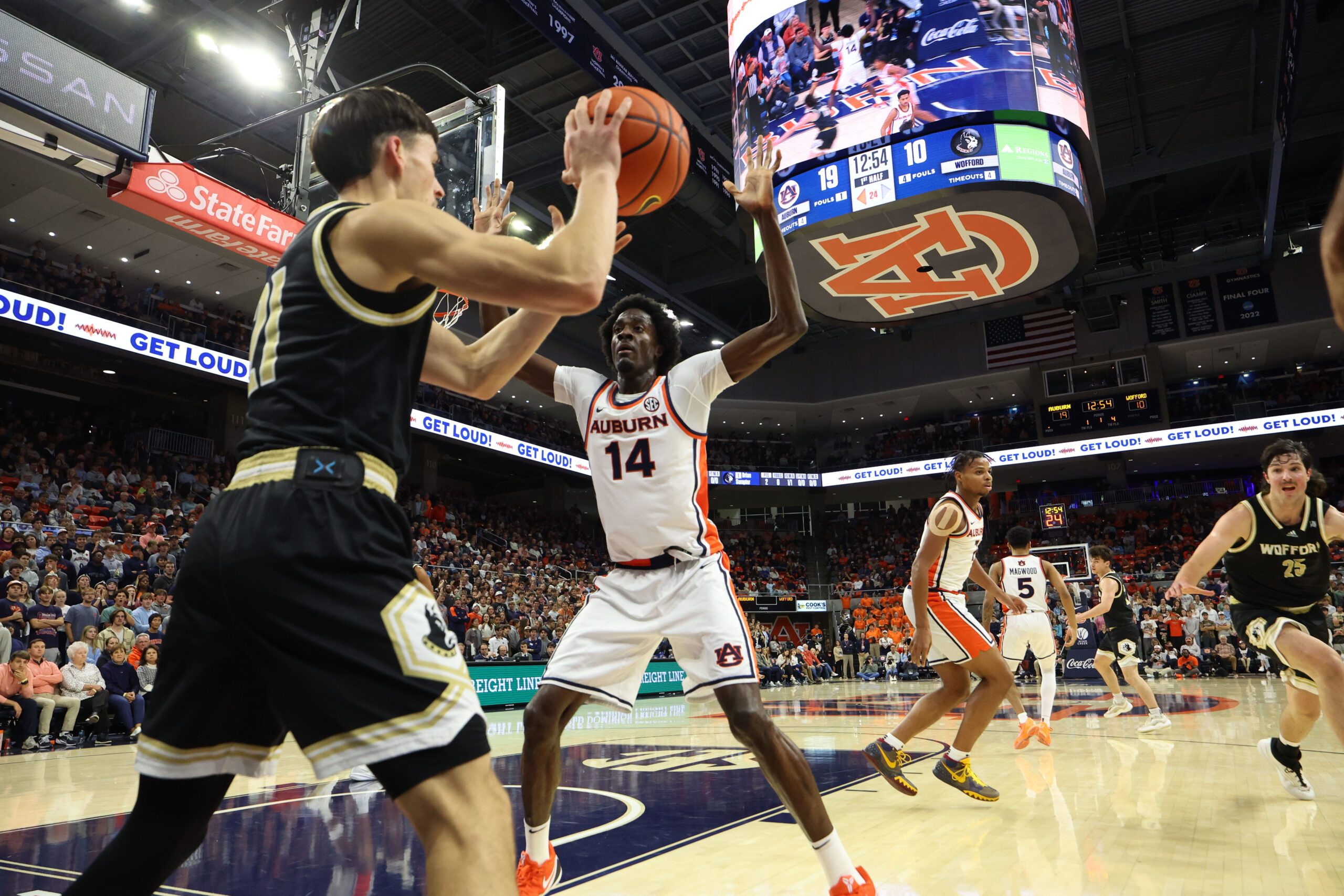 Nov 11, 2025; Auburn, Alabama, USA;  Auburn Tigers center Emeka Opurum (14) pressures Wofford Terriers guard Nils MacHowski (21) on an inbounds pass during the first half at Neville Arena. Mandatory Credit: John Reed-Imagn Images