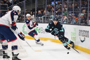 Nov 11, 2025; Seattle, Washington, USA; Seattle Kraken defenseman Jamie Oleksiak (24) plays the puck during the first period against the Columbus Blue Jackets at Climate Pledge Arena. Mandatory Credit: Steven Bisig-Imagn Images