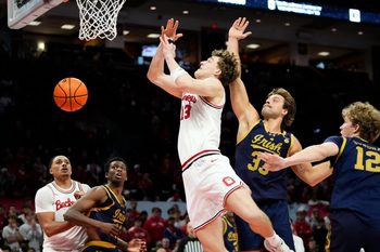 Notre Dame Fighting Irish forward Carson Towt (33) blocks the shot of Ohio State Buckeyes center Christoph Tilly (13) during the men's NCAA basketball game at Value City Arena in Columbus on Nov. 16, 2025. Ohio State won 64-63.