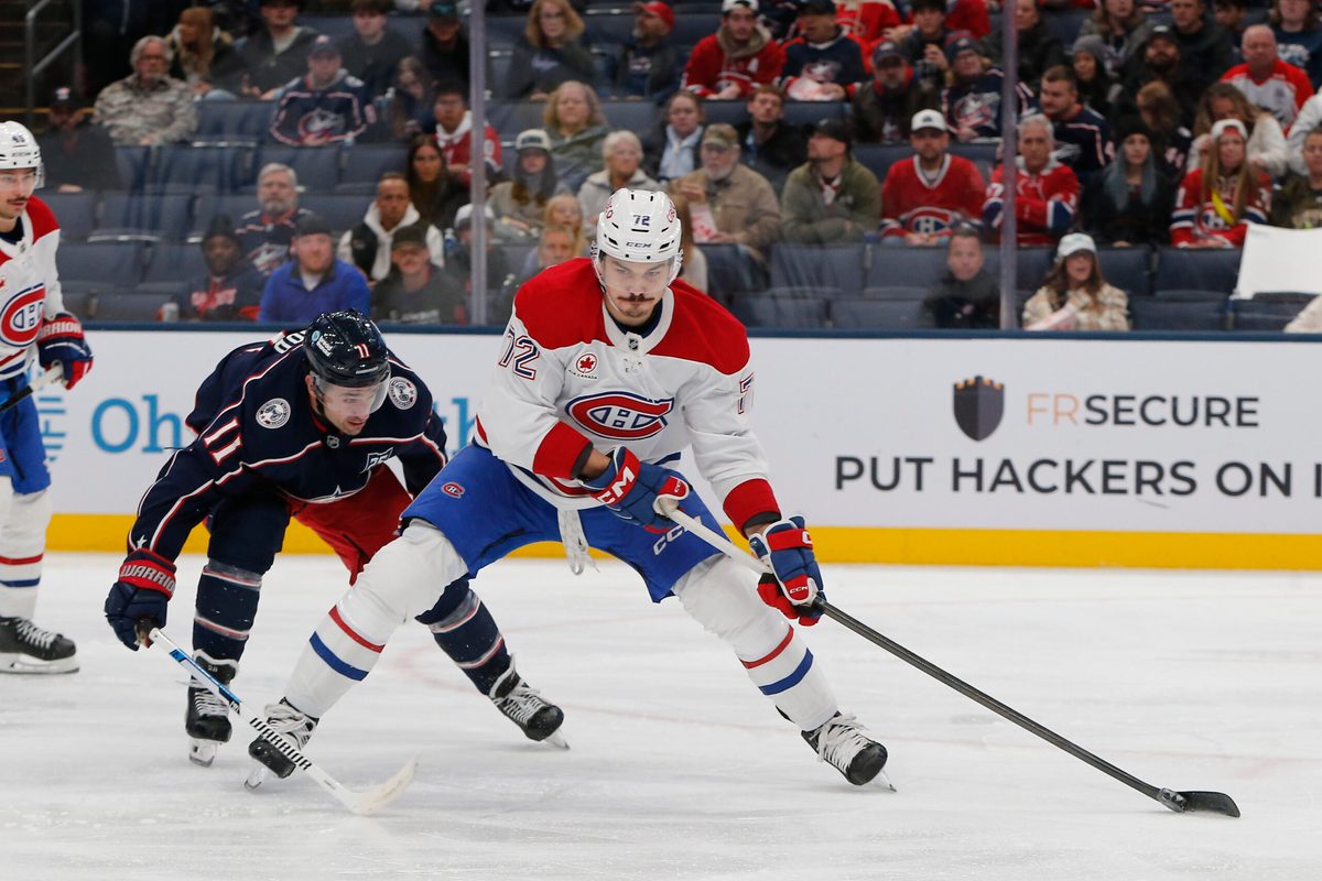Nov 17, 2025; Columbus, Ohio, USA; Montreal Canadiens defenseman Arber Xhekaj (72) controls the puck as Columbus Blue Jackets left wing Miles Wood (11) trails the play during the second period at Nationwide Arena. Mandatory Credit: Russell LaBounty-Imagn Images