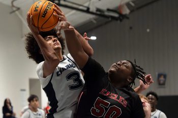 Nov 17, 2025; Northport, Alabama, USA; North River's Austin Harmon (3) battles for a shot agaisnt Victory Christian's Reben Skinner (50) at North River Christian Academy’s home gym at New Beginning Family Worship Center.