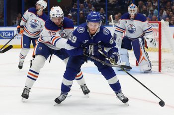 Nov 20, 2025; Tampa, Florida, USA;  Edmonton Oilers defenseman Alec Regula (75) defends against Tampa Bay Lightning center Jake Guentzel (59) during the first period at Benchmark International Arena. Mandatory Credit: Kim Klement Neitzel-Imagn Images