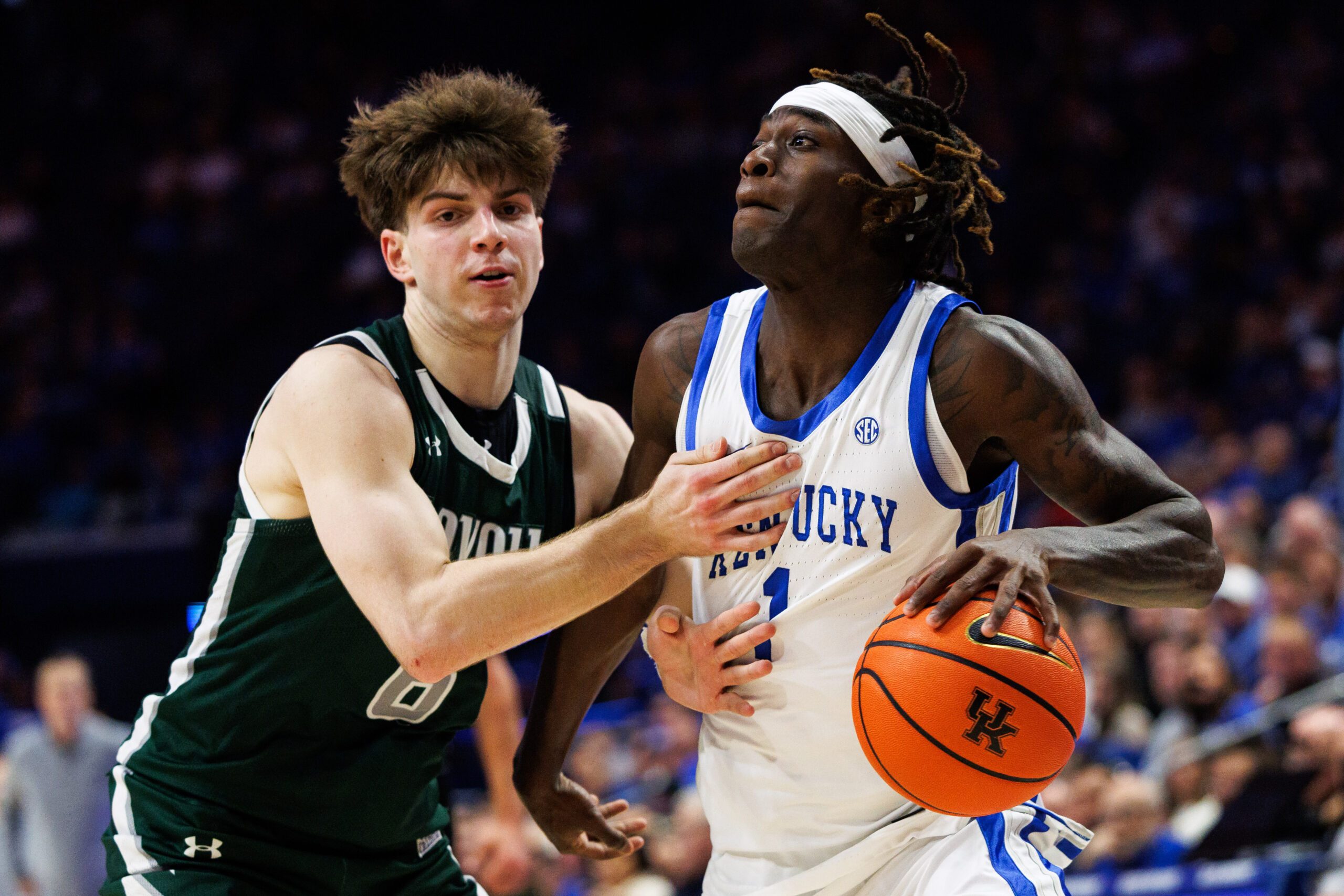 Nov 21, 2025; Lexington, Kentucky, USA; Kentucky Wildcats guard Denzel Aberdeen (1) drives to the basket against Loyola (MD) Greyhounds guard Jacob Theodosiou (6) during the second half at Rupp Arena at Central Bank Center. Mandatory Credit: Jordan Prather-Imagn Images