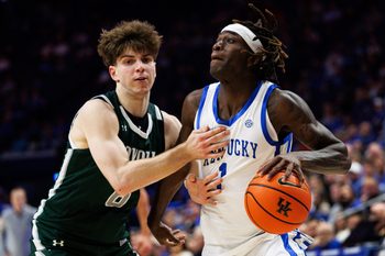 Nov 21, 2025; Lexington, Kentucky, USA; Kentucky Wildcats guard Denzel Aberdeen (1) drives to the basket against Loyola (MD) Greyhounds guard Jacob Theodosiou (6) during the second half at Rupp Arena at Central Bank Center. Mandatory Credit: Jordan Prather-Imagn Images