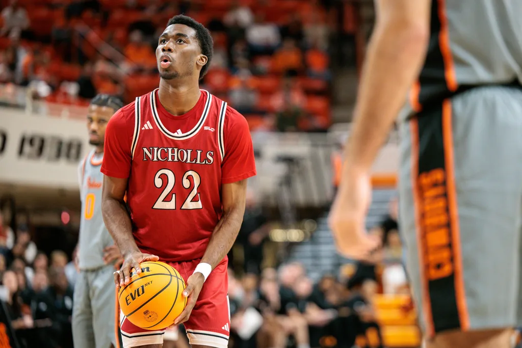 Nov 22, 2025; Stillwater, Oklahoma, USA; Nicholls Colonels guard Jalik Dunkley (22) shoots a free throw during the second half against the Oklahoma State Cowboys at Gallagher-Iba Arena. Mandatory Credit: William Purnell-Imagn Images