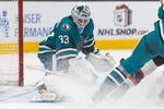 Nov 22, 2025; San Jose, California, USA;  San Jose Sharks goaltender Alex Nedeljkovic (33) defends the goal during the third period against the Ottawa Senators at SAP Center at San Jose. Mandatory Credit: Stan Szeto-Imagn Images