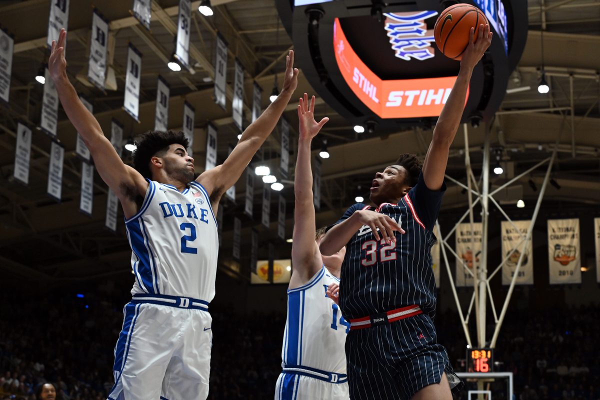 Nov 23, 2025; Durham, North Carolina, USA;  Howard Bison forward Travelle Bryson (32) shoots the ball over Duke Blue Devils guard Cayden Boozer (2) during the first half at Cameron Indoor Stadium. Mandatory Credit: Rob Kinnan-Imagn Images
