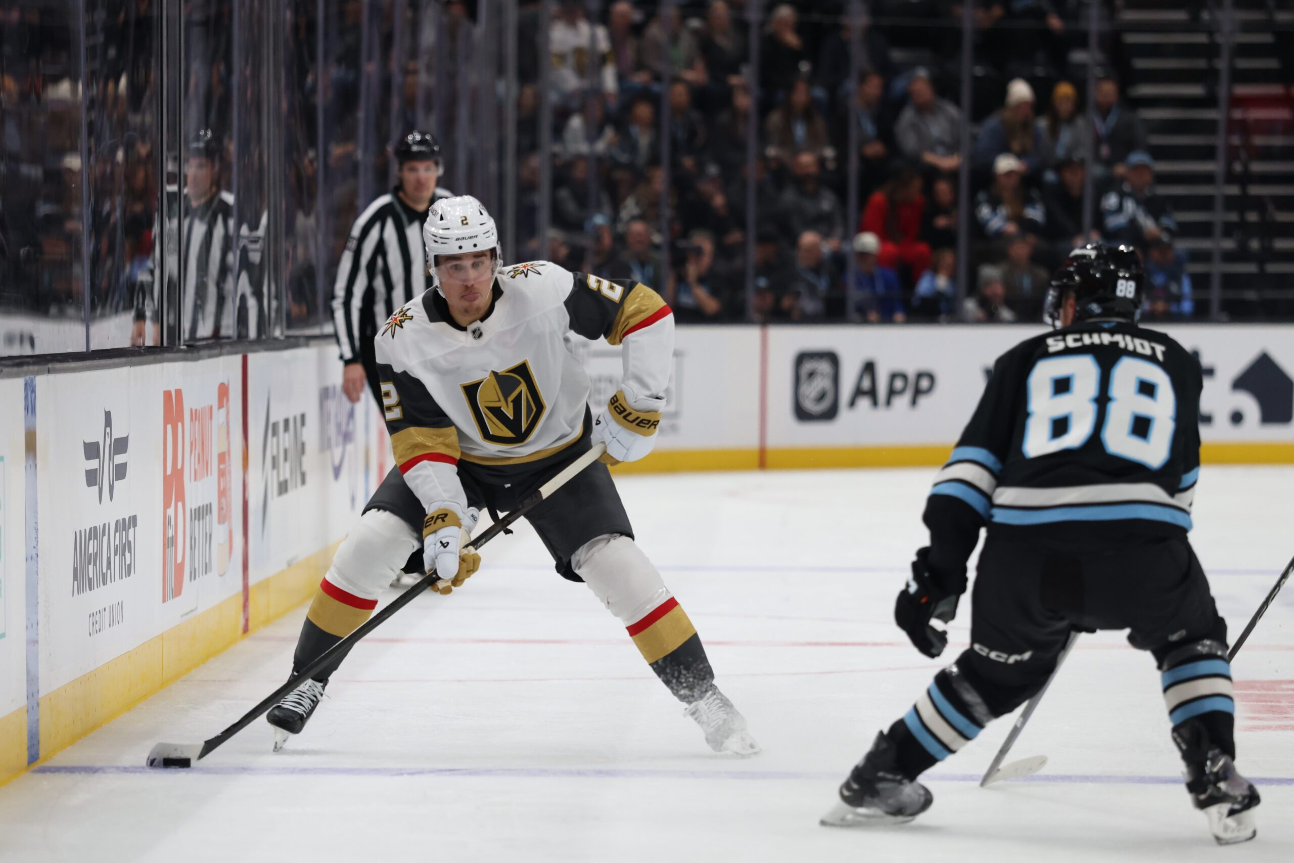 Nov 24, 2025; Salt Lake City, Utah, USA; Vegas Golden Knights defenseman Zach Whitecloud (2) looks to pass against Utah Mammoth defenseman Nate Schmidt (88) during the second period at Delta Center. Mandatory Credit: Rob Gray-Imagn Images