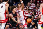 Nov 24, 2025; Tucson, Arizona, USA; Denver Pioneers forward Jeremiah Burke (0) passes the ball during the second half of the game against the Arizona Wildcats at McKale Memorial Center. Mandatory Credit: Aryanna Frank-Imagn Images