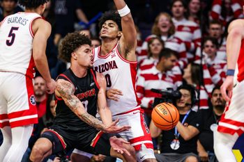 Nov 24, 2025; Tucson, Arizona, USA; Denver Pioneers forward Jeremiah Burke (0) passes the ball during the second half of the game against the Arizona Wildcats at McKale Memorial Center. Mandatory Credit: Aryanna Frank-Imagn Images