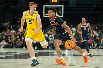 Nov 25, 2025; Las Vegas, NV, USA; Auburn Tigers guard Keyshawn Hall (7) drives to the basket against Michigan Wolverines forward Oscar Goodman (5) during the second half in a 2025 Players Era Festival group play game at Michelob ULTRA Arena. Mandatory Credit: Kirby Lee-Imagn Images