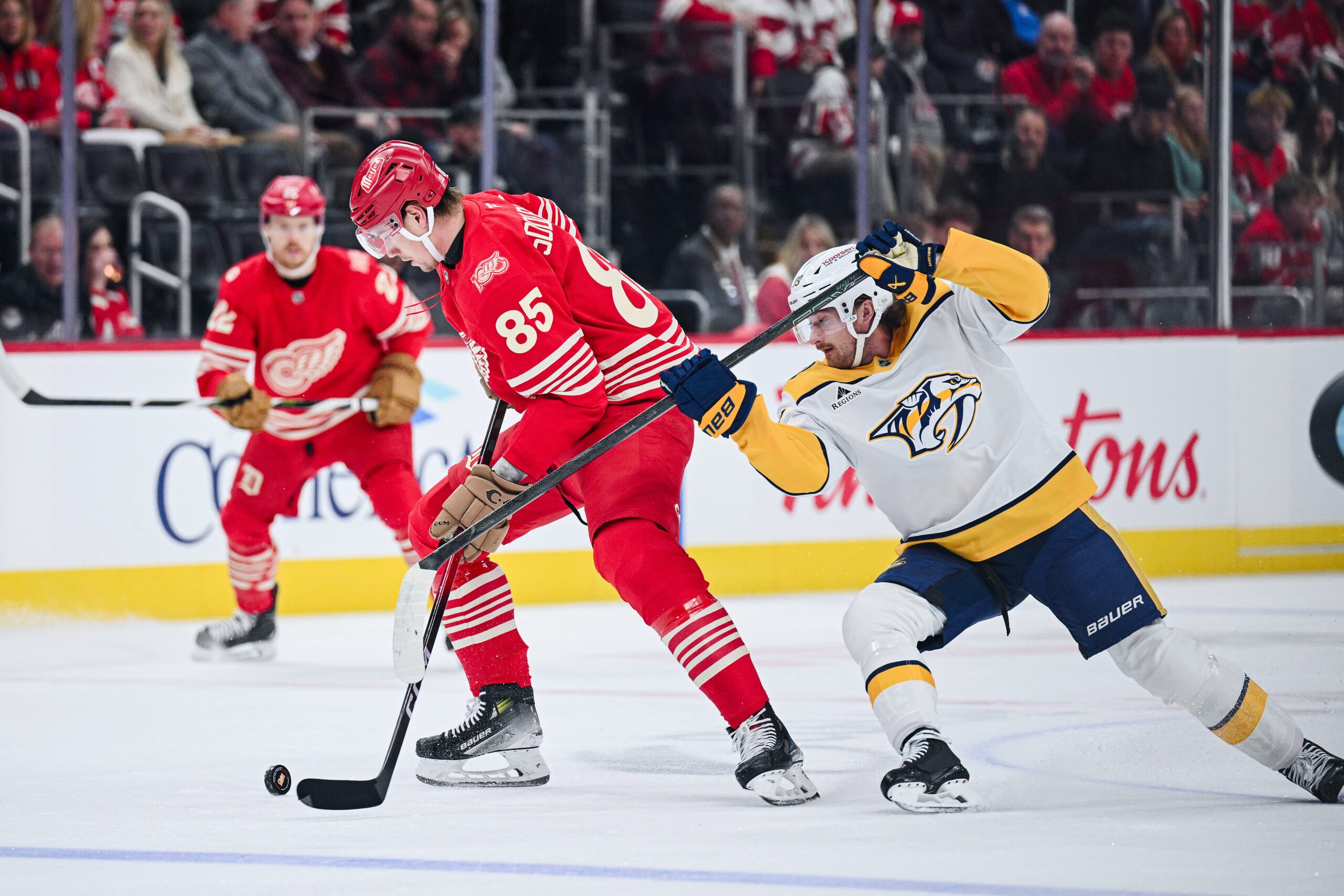 Nov 26, 2025; Detroit, Michigan, USA; Detroit Red Wings left wing Elmer Soderblom (85) and Nashville Predators right wing Ozzy Wiesblatt (89) battle for the puck during the first period at Little Caesars Arena. Mandatory Credit: Tim Fuller-Imagn Images