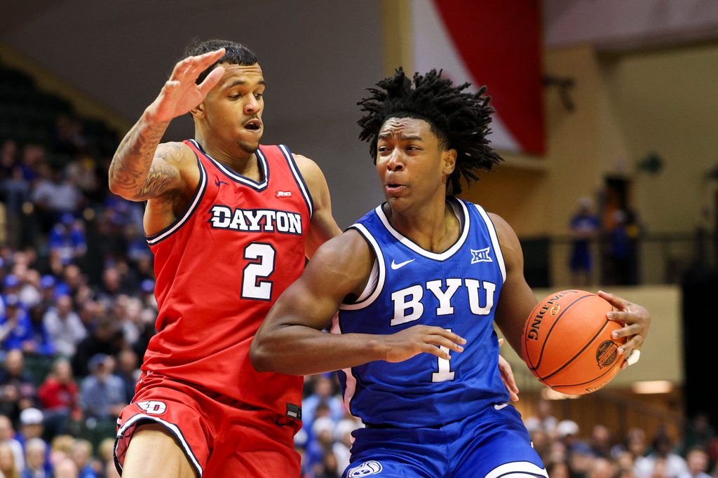 Nov 28, 2025; Kissimmee, FL, USA; Brigham Young University Cougars guard Robert Wright III (1) is guarded by Dayton Flyers guard De'Shayne Montgomery (2) in the second half during the ESPN Events Invitational at State Farm Field House. Mandatory Credit: Nathan Ray Seebeck-Imagn Images