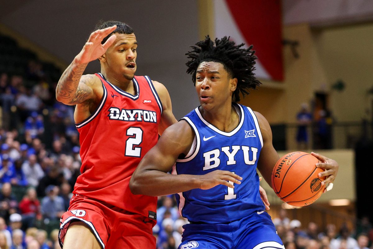 Nov 28, 2025; Kissimmee, FL, USA; Brigham Young University Cougars guard Robert Wright III (1) is guarded by Dayton Flyers guard De'Shayne Montgomery (2) in the second half during the ESPN Events Invitational at State Farm Field House. Mandatory Credit: Nathan Ray Seebeck-Imagn Images