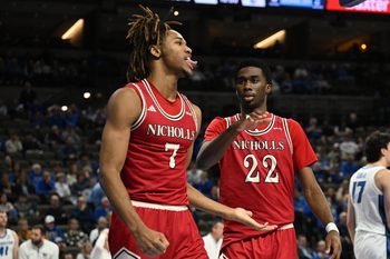 Dec 2, 2025; Omaha, Nebraska, USA;  Nicholls State Colonels forward Grant Sanders (7) reacts with guard Jalik Dunkley (22) against the Creighton Bluejays during the first half at CHI Health Center Omaha. Mandatory Credit: Steven Branscombe-Imagn Images