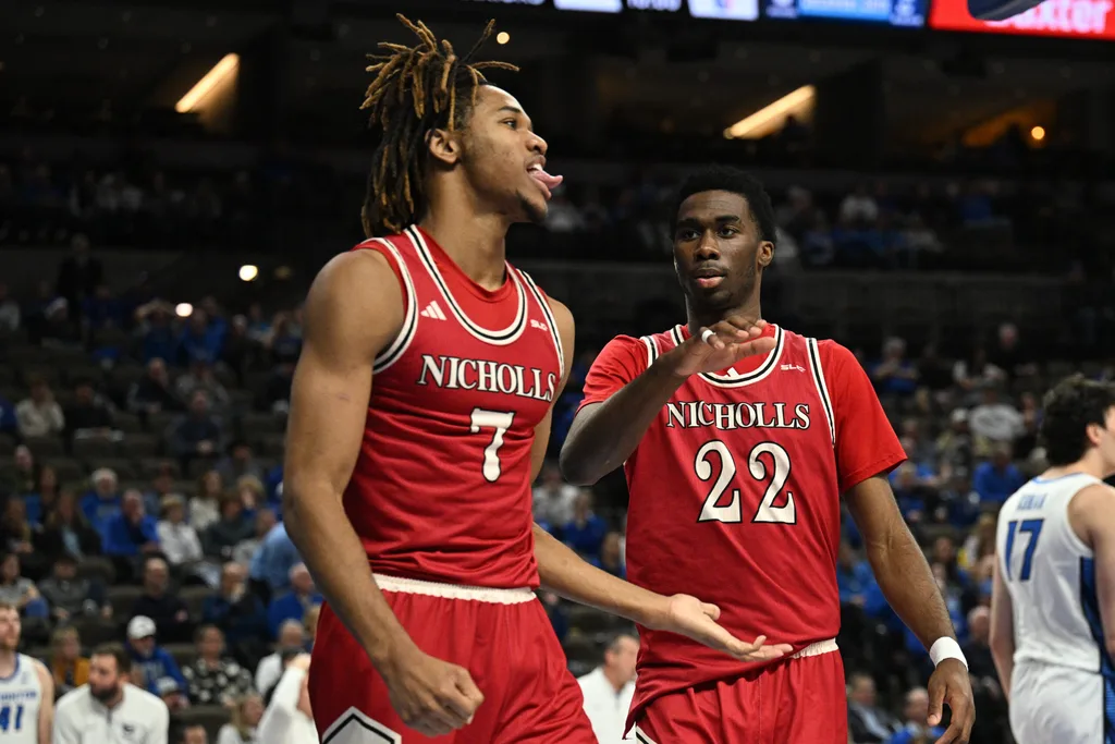 Dec 2, 2025; Omaha, Nebraska, USA; Nicholls State Colonels forward Grant Sanders (7) reacts with guard Jalik Dunkley (22) against the Creighton Bluejays during the first half at CHI Health Center Omaha. Mandatory Credit: Steven Branscombe-Imagn Images