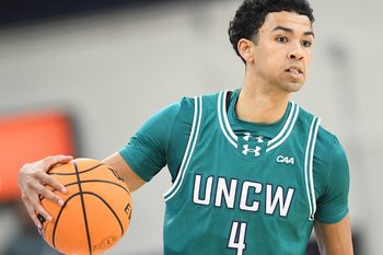 UNCW's #4 Nolan Hodge looks to pass off the ball as UNCW played Marshall.