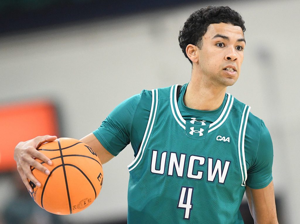 UNCW's #4 Nolan Hodge looks to pass off the ball as UNCW played Marshall.