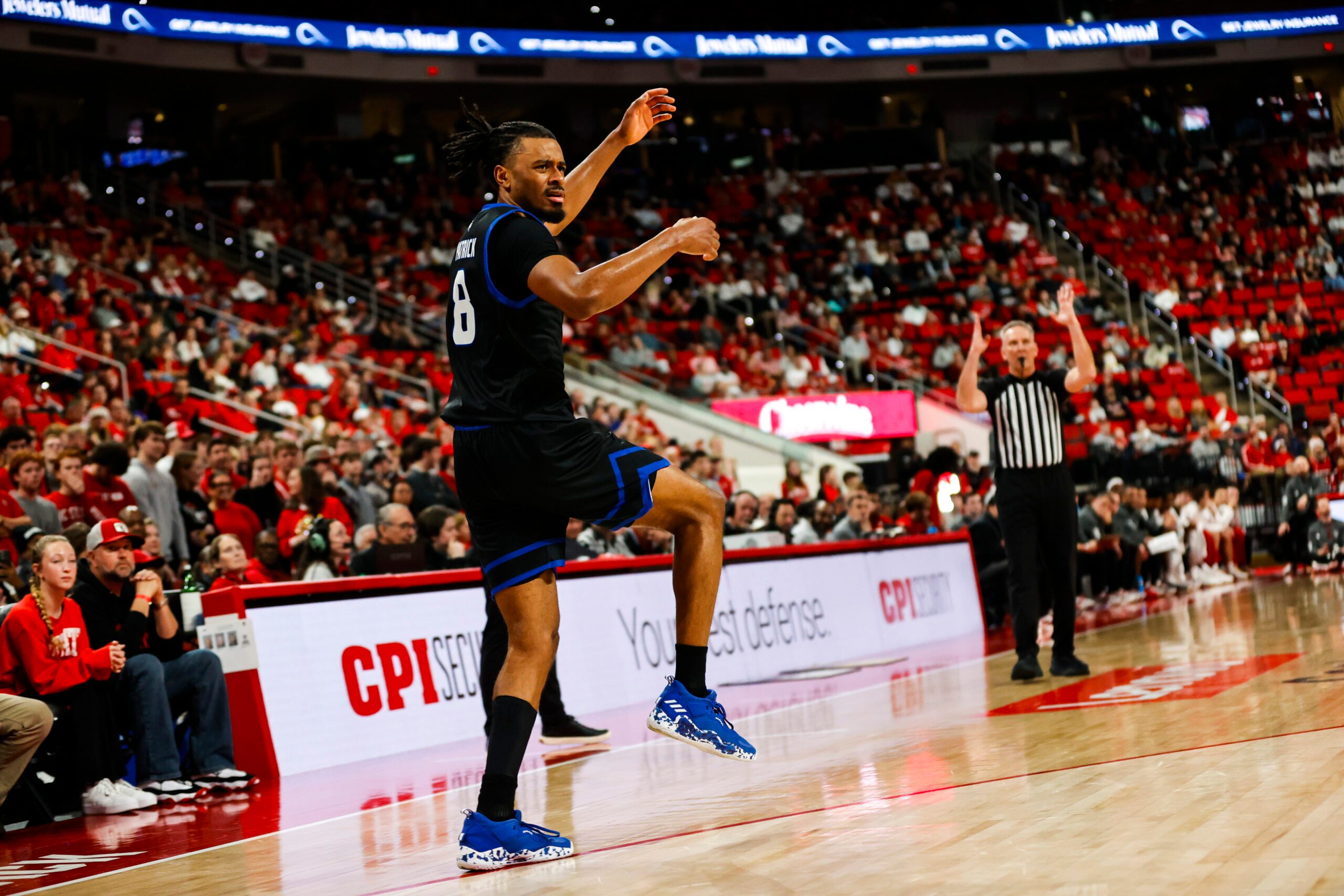 Dec 6, 2025; Raleigh, North Carolina, USA; UNC Asheville Bulldogs guard Kameron Taylor (3) reacts to his three-point shot during the second half of the game against NC State Wolfpack at Lenovo Center. Mandatory Credit: Jaylynn Nash-Imagn Images